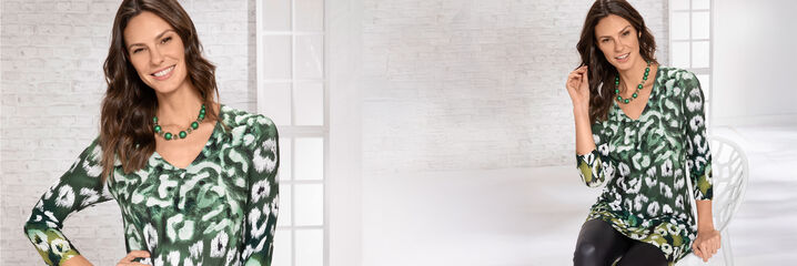 Dame mit gr&uuml;n-wei&szlig;er Tunika und schwarzer Hose